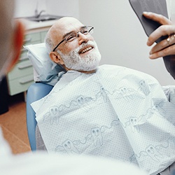Man smiling at dentist in McKinney