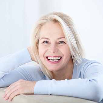 Smiling woman with dental implants in McKinney