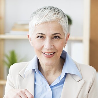 Older woman smiling after restorative dentistry