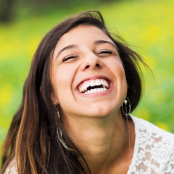 Young woman smiling after dental bonding treatment