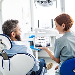 McKinney orthodontist explaining X-ray to patient