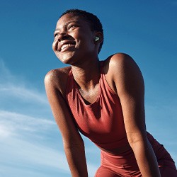 Lady smiles after exercising outdoors