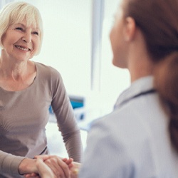 Patient and dentist discussing cost of full mouth reconstruction in McKinney