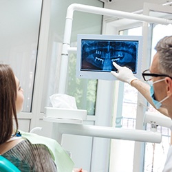 Dental implant dentist in McKinney showing a patient their dental X-rays