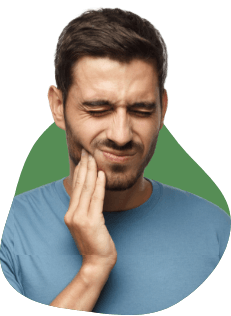 man holding his jaw in pain