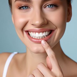 Woman showing off her smile after undergoing cosmetic dentistry