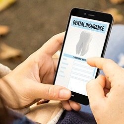 A woman looking at a dental insurance app