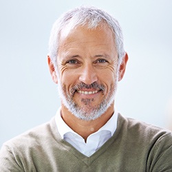 Man smiling happily after periodontal therpay