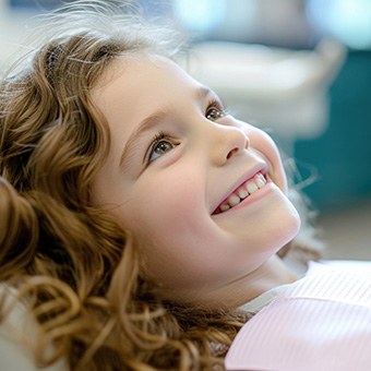 A child visiting the dentist’s office for dental sealants in McKinney 