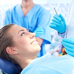 Female patient happily getting dental examination under oral conscious dental sedation