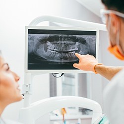 Dentist explaining x-ray to patient