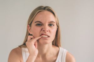 a woman with red gums