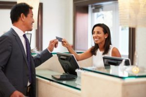 A person paying for their dental treatment.