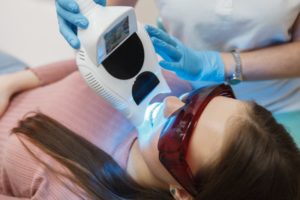 woman getting teeth whitening 