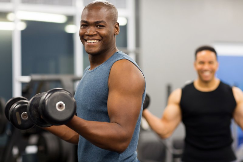 person smiling while working out
