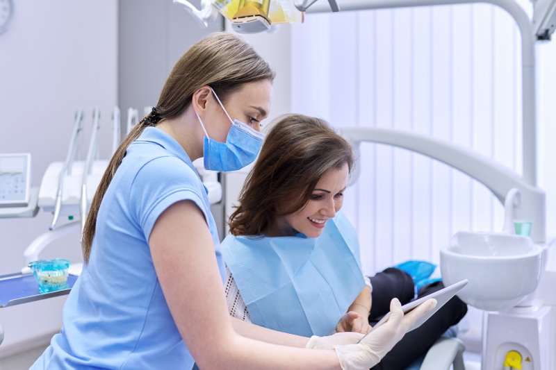 A dentist explaining dental financing to a patient