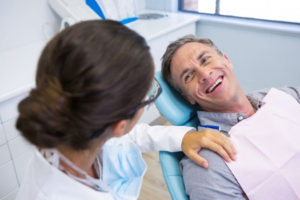 a patient visiting their dentist for a root canal
