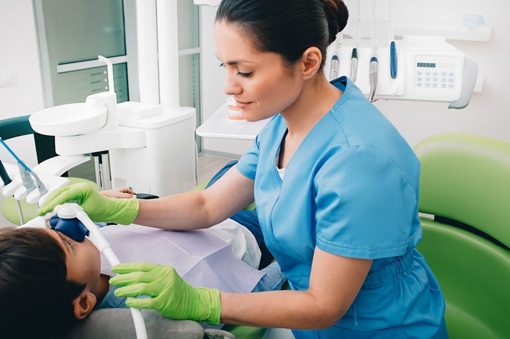 child at dentist receiving nitrous oxide sedation